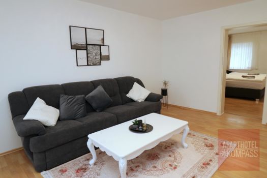 Apartment 404 - Schlafzimmer für 2 Personen, Wohnzimmer mit Flat-TV, Küche, modernes Duschbad und kleiner Balkon